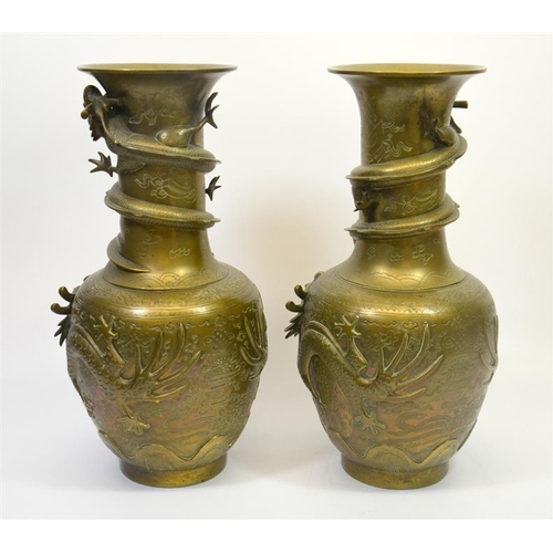 74 - A large pair of Chinese bronze vases, cast in relief with dragons and pearls, cast marks set to the ... 