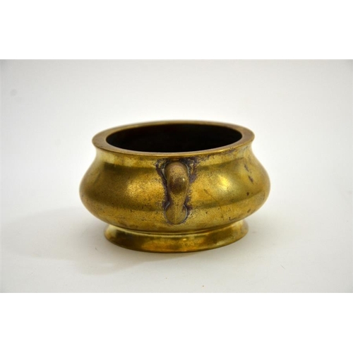 78 - A Chinese bronze censer, squat baluster form with twin handles, Xuande cast seal mark, 16cm wide, 85... 