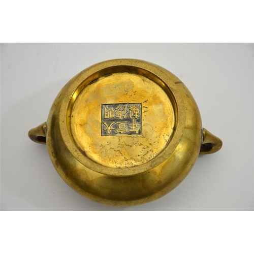 78 - A Chinese bronze censer, squat baluster form with twin handles, Xuande cast seal mark, 16cm wide, 85... 