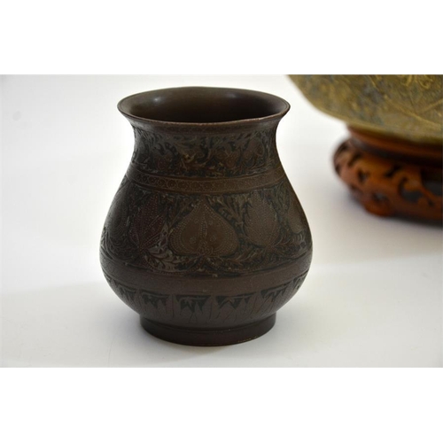 79 - An Indian gilt brass cast bowl, together with niello white metal baluster vase and covered pot, bowl... 