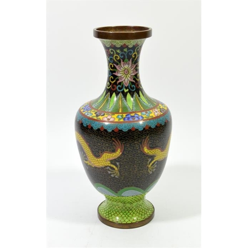 86 - A Chinese cloisonne enamelled vase, footed form, two five claw dragons flanking a flaming pearl, 26c... 