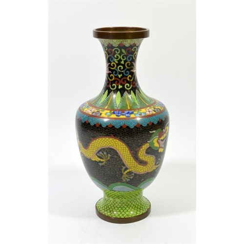 86 - A Chinese cloisonne enamelled vase, footed form, two five claw dragons flanking a flaming pearl, 26c... 