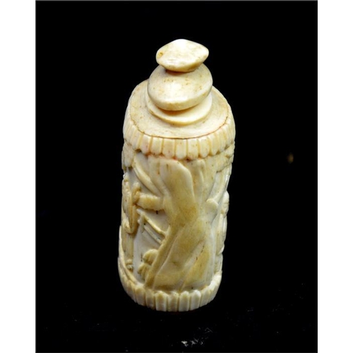 91 - A Chinese carved bone snuff bottle, 19th century, decorated in the round with elders in a garden lan... 