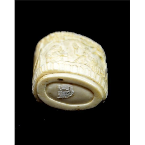 91 - A Chinese carved bone snuff bottle, 19th century, decorated in the round with elders in a garden lan... 