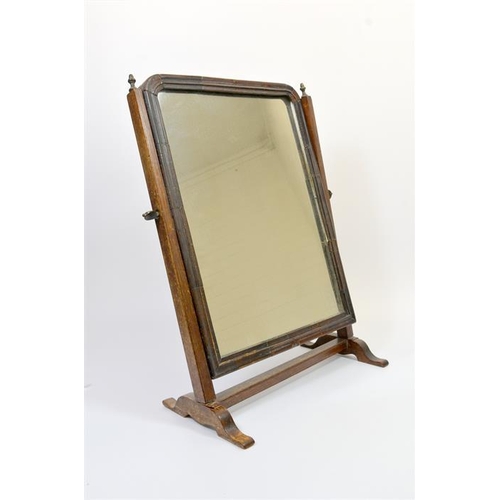 228 - A George III oak and mahogany swing toilet mirror, glass size 35cm x 25cm