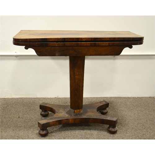 239 - A William IV rosewood foldover pedestal card table, swivel topped, on tapered octagonal support and ... 