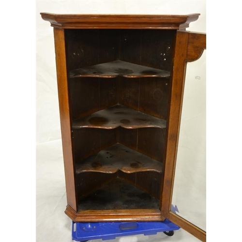 244 - A George III oak glazed corner cabinet, the interior with three shelves, 106cm tall, 65cm wide