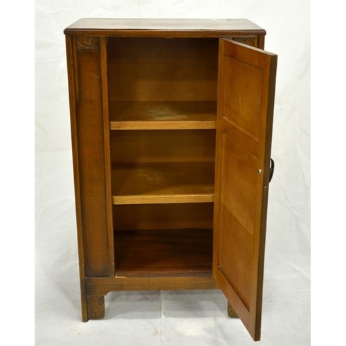 249 - A 1920s oak cupboard, of small proportions, single drawer, on bracket feet, carved Art Deco style pa... 