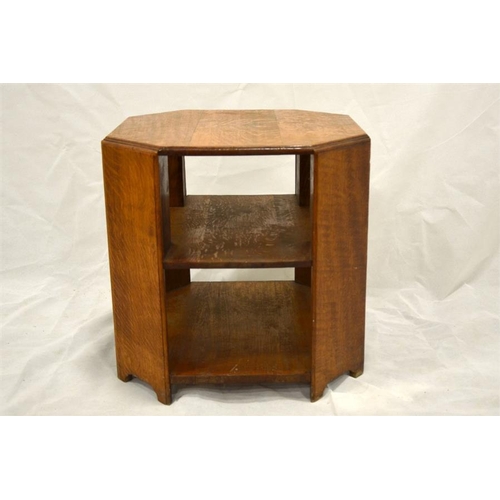 256 - An Art Deco golden oak occasional table bookcase, octagonal section with boarded plank uprights unit... 