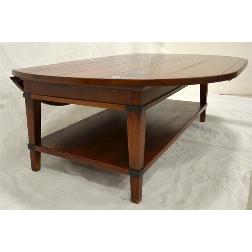 268 - A contemporary oak drop leaf coffee table, plank and peg construction with low shelf and ebonised de... 