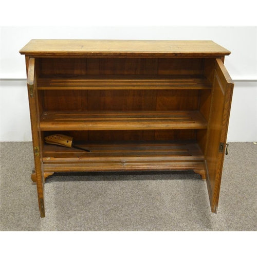 276 - A Victorian light oak linen airing cupboard, the double doors opening to reveal slatted shelves and ... 