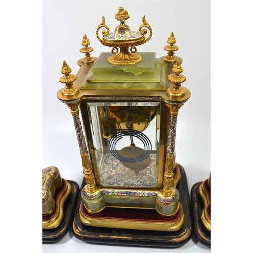 279 - A French champleve enamel, ormolu and onyx clock garniture, under glass domes, the Japy Freres movem... 