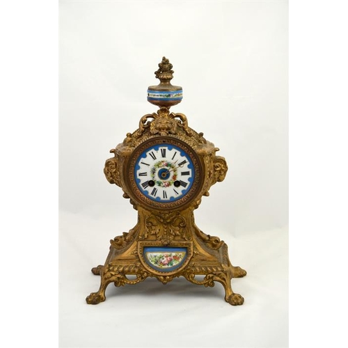 285 - A clock garniture with Sevres style porcelain plaques and roundel and the dial decorated with a flor... 