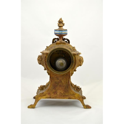 285 - A clock garniture with Sevres style porcelain plaques and roundel and the dial decorated with a flor... 