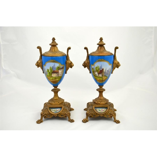 285 - A clock garniture with Sevres style porcelain plaques and roundel and the dial decorated with a flor... 