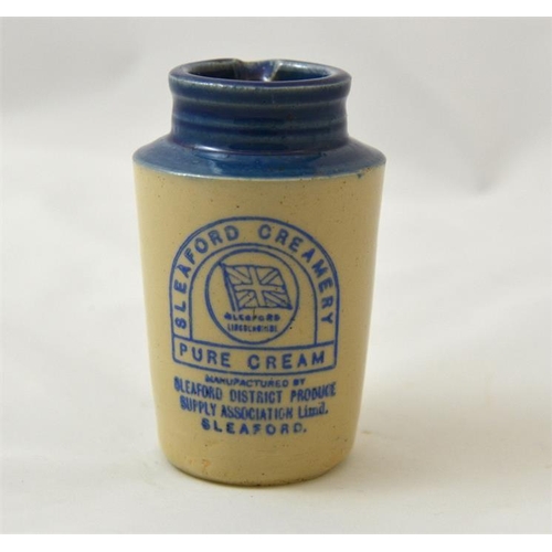 516 - A blue top cream pot (small size) from the Sleaford Creamery 11cm high.