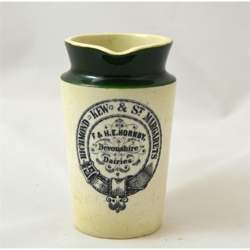 521 - A green top cream jug from F & HE Hornby Richmond, Kew & St Margarets  11cm high.