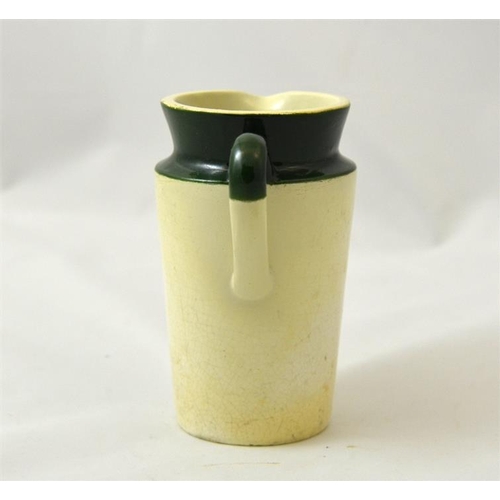 521 - A green top cream jug from F & HE Hornby Richmond, Kew & St Margarets  11cm high.