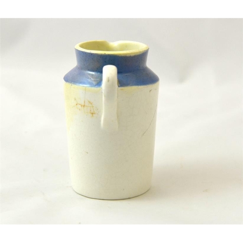 523 - A blue top cream jug from J Clarke & Sons, Chiswick, Kew Gardens and Richmond 10cm high.