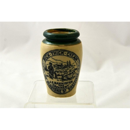 525 - A green top cream pot from JE Bannister, The Creamery, Pinstone Street, Sheffield 9.5cm high.