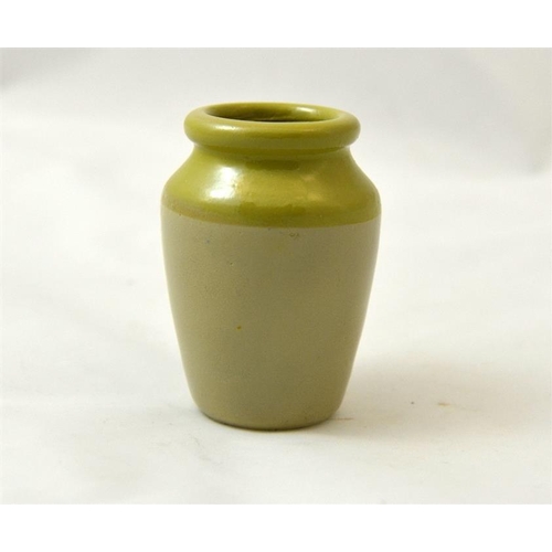 528 - A green top cream pot from Failsworth Industrial Co-operative Society 7.5cm high.