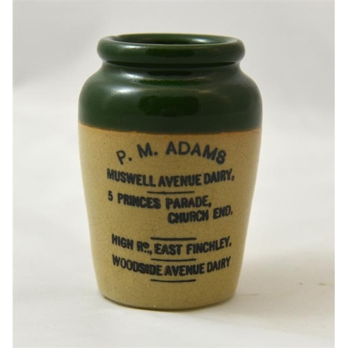 535 - A green top cream pot from P.M. Adams, Muswell Avenue Dairy, Finchley 9cm high.