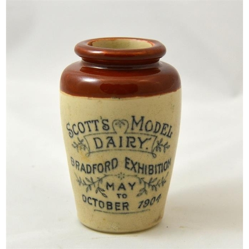 549 - A brown top cream pot from Scott's Model Dairy Bradford Exhibition 1904 with buildings pictured on r... 