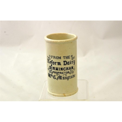 553 - A cylinder cream pot from the Reform Dairy Birmingham 12cm high.