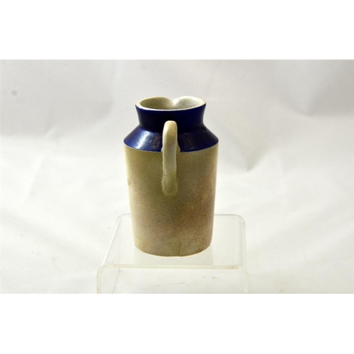 555 - A blue top cream jug from the West Central Dairy, Bedford Square, London 10.5cm high.