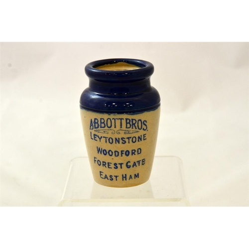 557 - A blue top cream pot from Abbott Bros, Leytonstone, Woodford, Forest Gate, East Ham 9.5cm high.