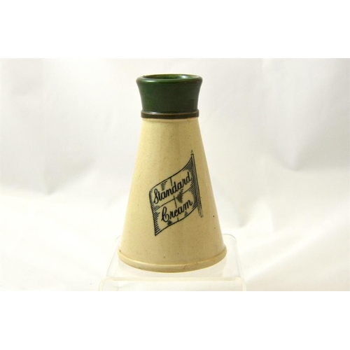 560 - A green top cream pot with 'Standard Cream' mark 13.5cm high.