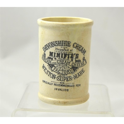 561 - A small cylinder cream pot from Minifies, Weston-super-Mare 8.5cm high.