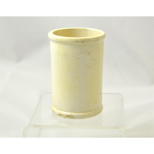 561 - A small cylinder cream pot from Minifies, Weston-super-Mare 8.5cm high.