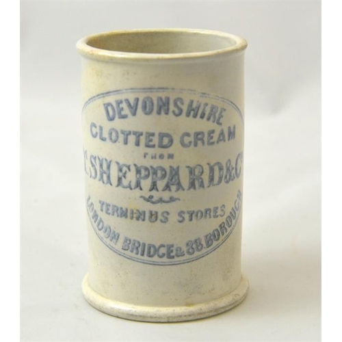 587 - A cylinder cream pot from T Sheppard & Co, Terminus Stores London Bridge 10.5cm high.