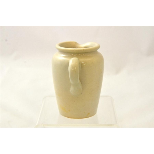 592 - A handled cream jug from JT Edwards Richmond Hill Dairy in blue print 9cm high.