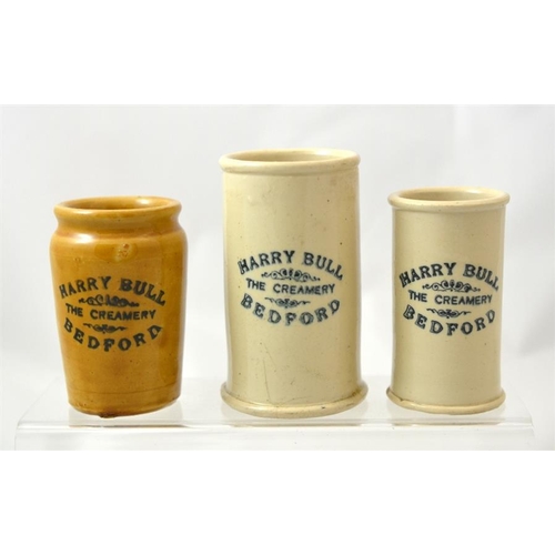 613 - Two cylinder cream pots from Harry Bull, The Creamery Bedford, and another in honey glaze (3) 11.5cm... 