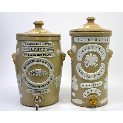 626 - Two stoneware advertising water filters, including the Atkins Filter Engineering & Water Softening C... 