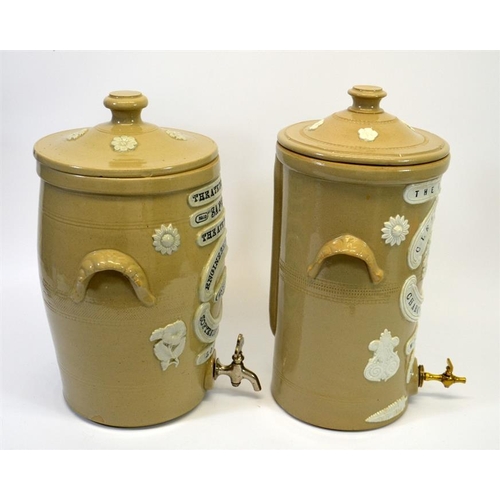 626 - Two stoneware advertising water filters, including the Atkins Filter Engineering & Water Softening C... 