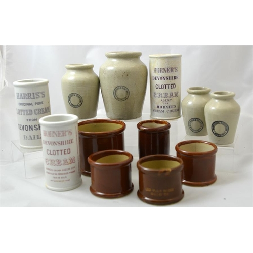 639 - A group of stoneware cream pots and jars, including a graduated set from Barwood & Chapman of Norwic... 