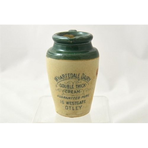 647 - A green top cream jug from Wharfedale Dairy Otley 10.5cm high.