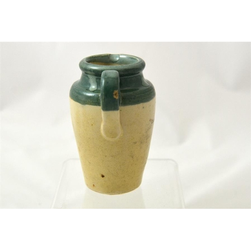 647 - A green top cream jug from Wharfedale Dairy Otley 10.5cm high.