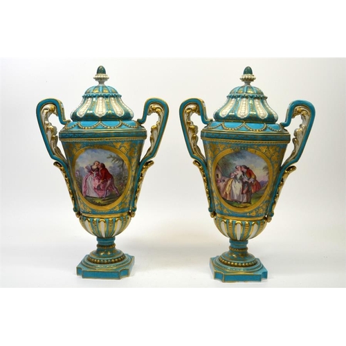 1593 - A pair of 19th century Sevres style vase and covers, decorated with panels after Watteau, and floral... 