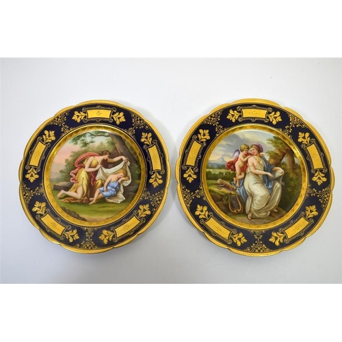 1597 - A pair of Vienna syle plates, painted with allegorical scenes, cobalt border with raised paste gildi... 