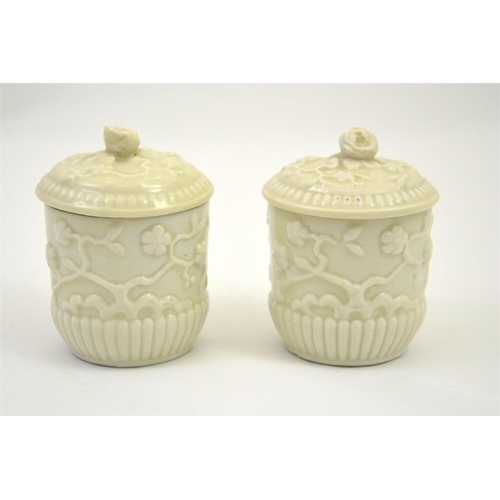 1603 - A pair of St Cloud porcelain chocolate pots and covers, 18th century, circa 1740, blanc de Chine, re... 