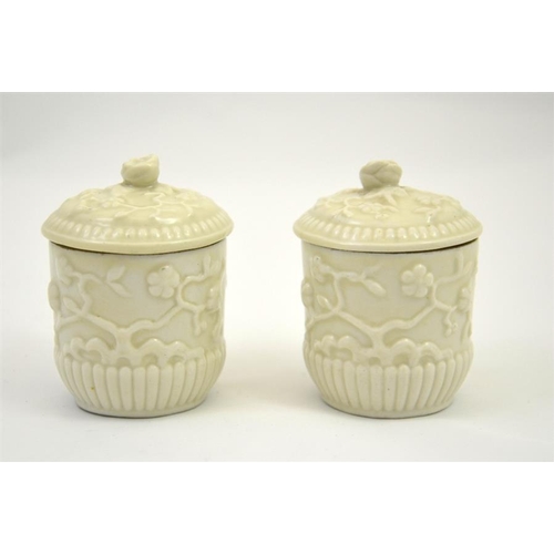 1603 - A pair of St Cloud porcelain chocolate pots and covers, 18th century, circa 1740, blanc de Chine, re... 