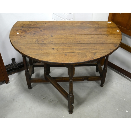 190 - An 18th century oak gateleg table, circa 1720, the single drawer with drop handle, turned column leg... 