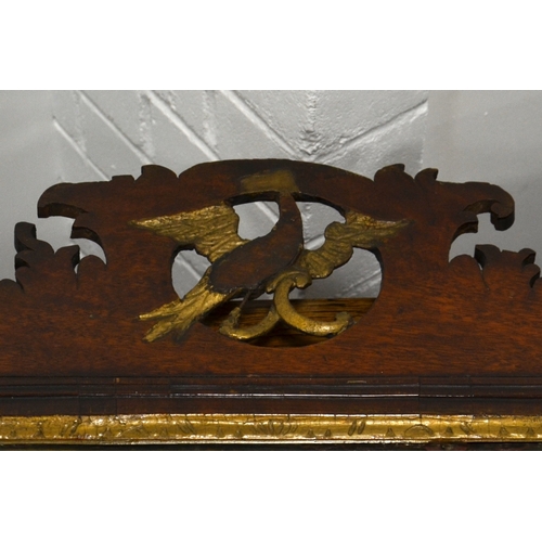 222 - A George II style mahogany fretwork mirror, pierced eagle motif to the pediment, 96cm high, 57cm wid... 