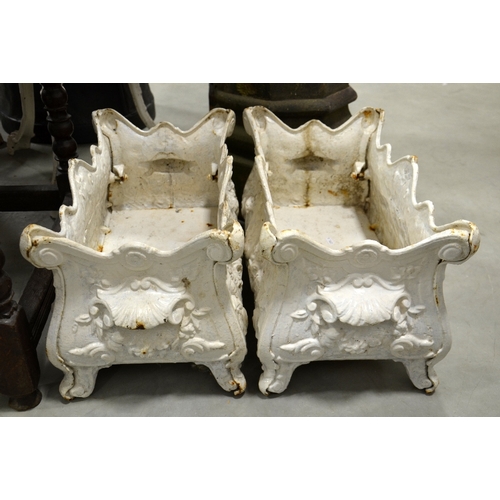 229 - A pair of Victorian cast iron planters, ogee bombe form, on cabriole legs, relief moulded with folia... 