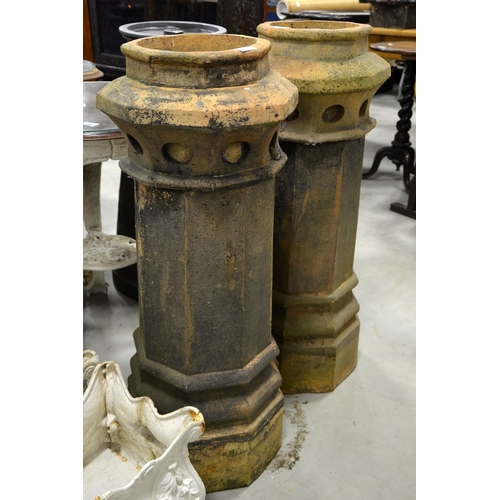 230 - A pair of Victorian terracotta chimney pots, octagonal section, tapered column form, 94cm high (2)