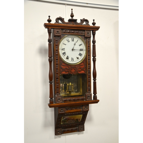 281 - An American walnut wall clock, Vienna style, simulated bamboo moulded borders and turned column supp... 